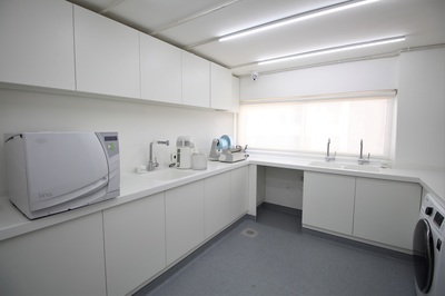 The sterilisation room at Dental Studio, with the autoclave along the near wall
